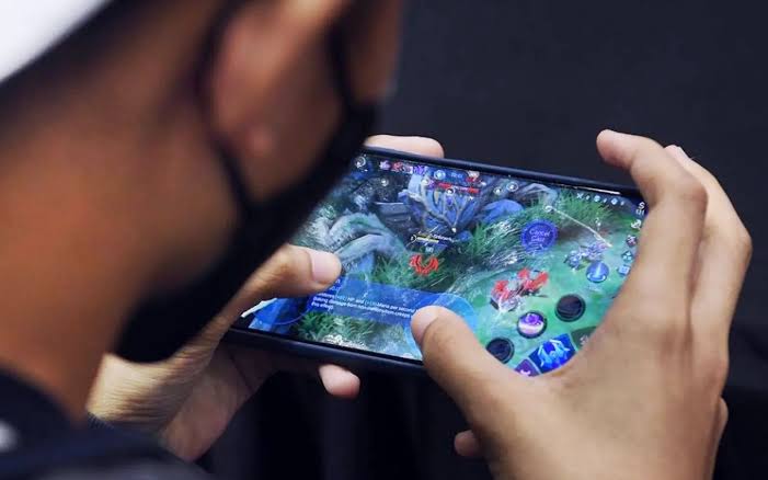 Mobile gaming interface shown inside an independent Australian technology display